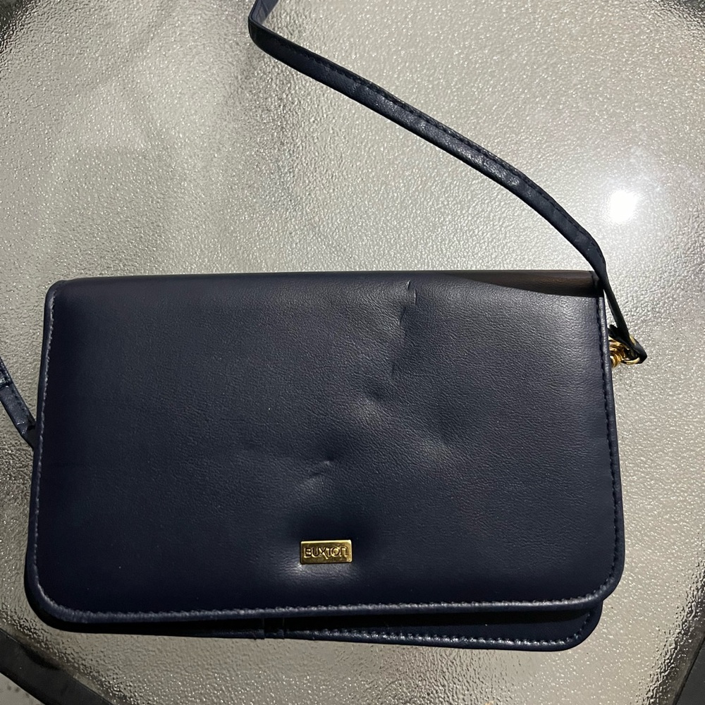 Buxton black crossbody bag with gold hardware and multiple pockets